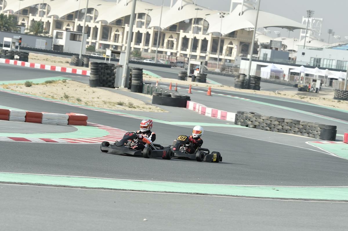 Two karts battling into a corner
