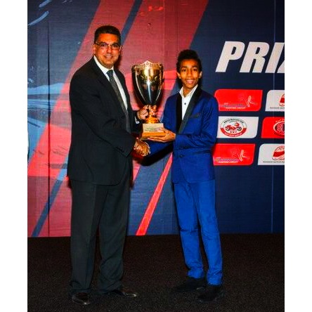 Young Abdallah receiving a trophy